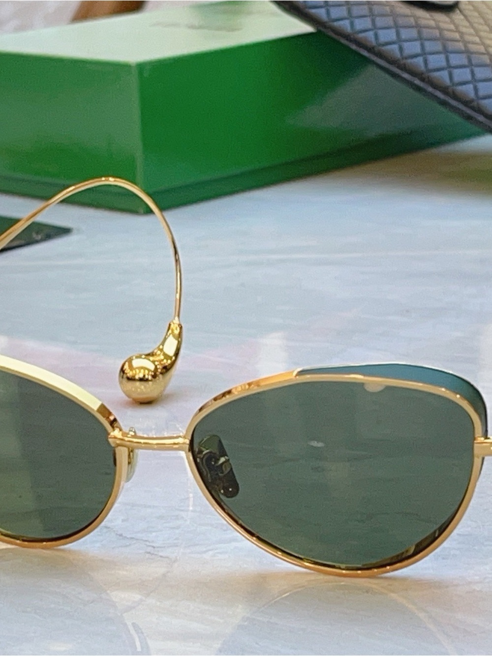 Bottega Veneta Gold Frame Sunglasses with Green Lenses